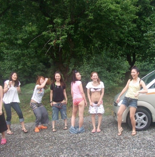 Seven slutty Japanese girls from the city strip off in the countryside photo pic