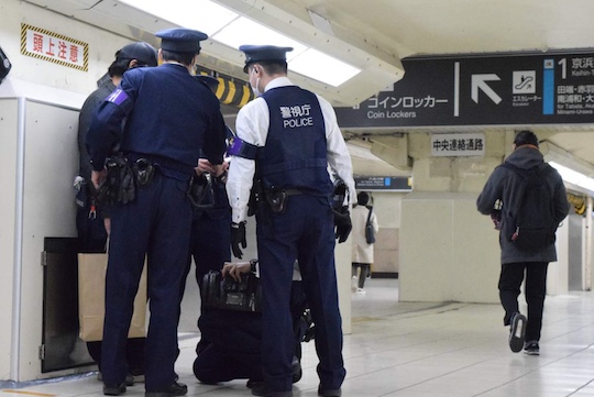 tokyo chikan train groper police officer cop arrested